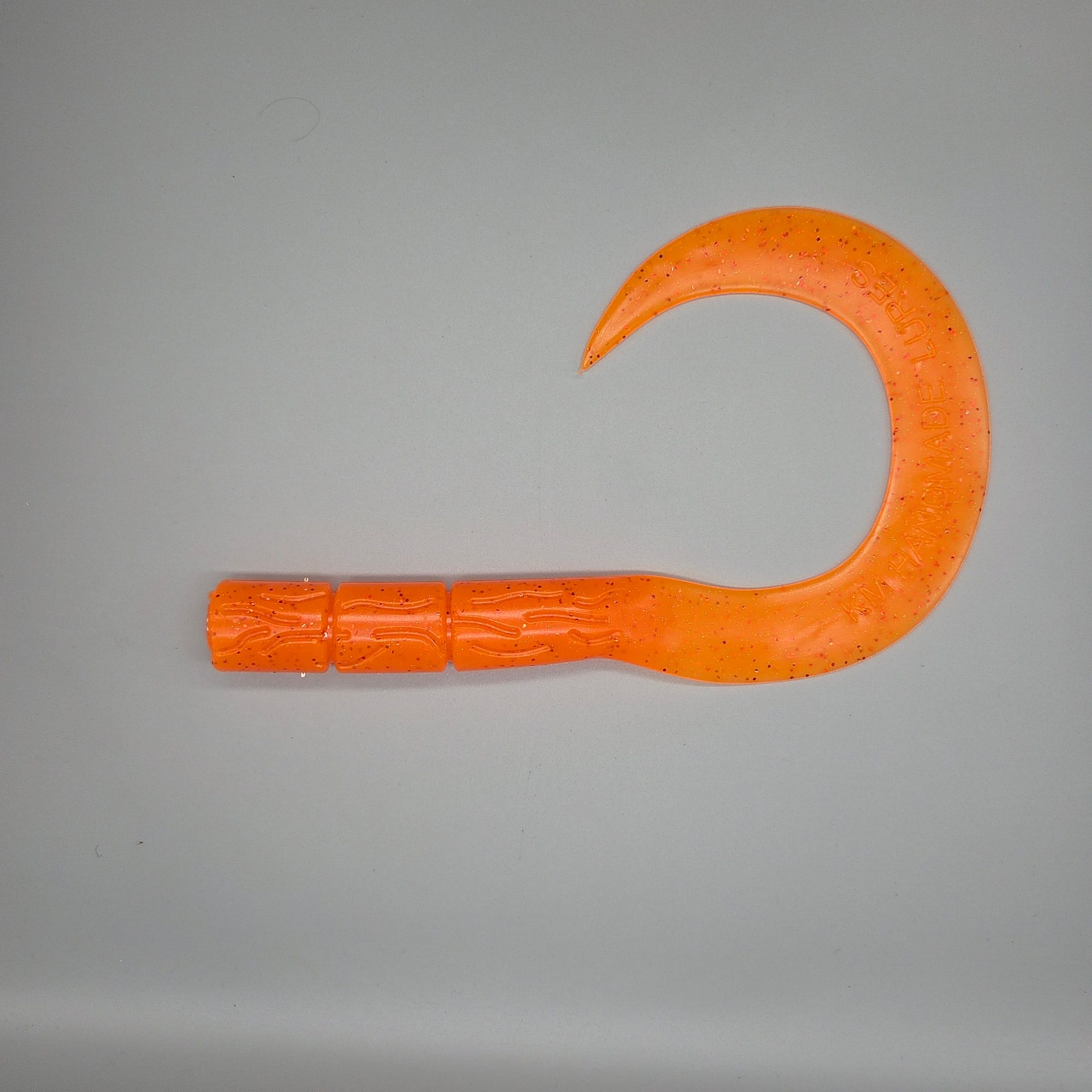 curly-tail-UV-orange