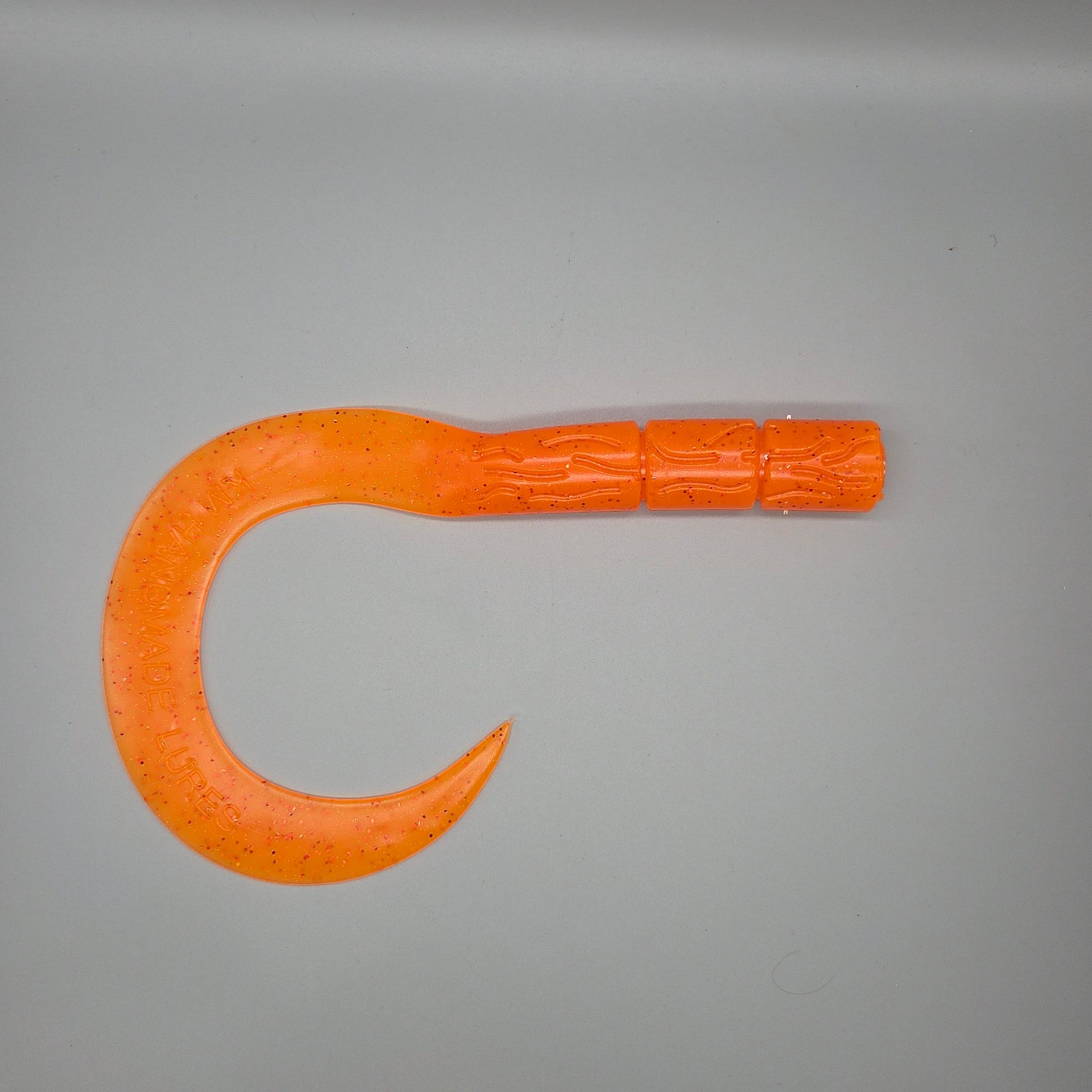 curly-tail-UV-orange